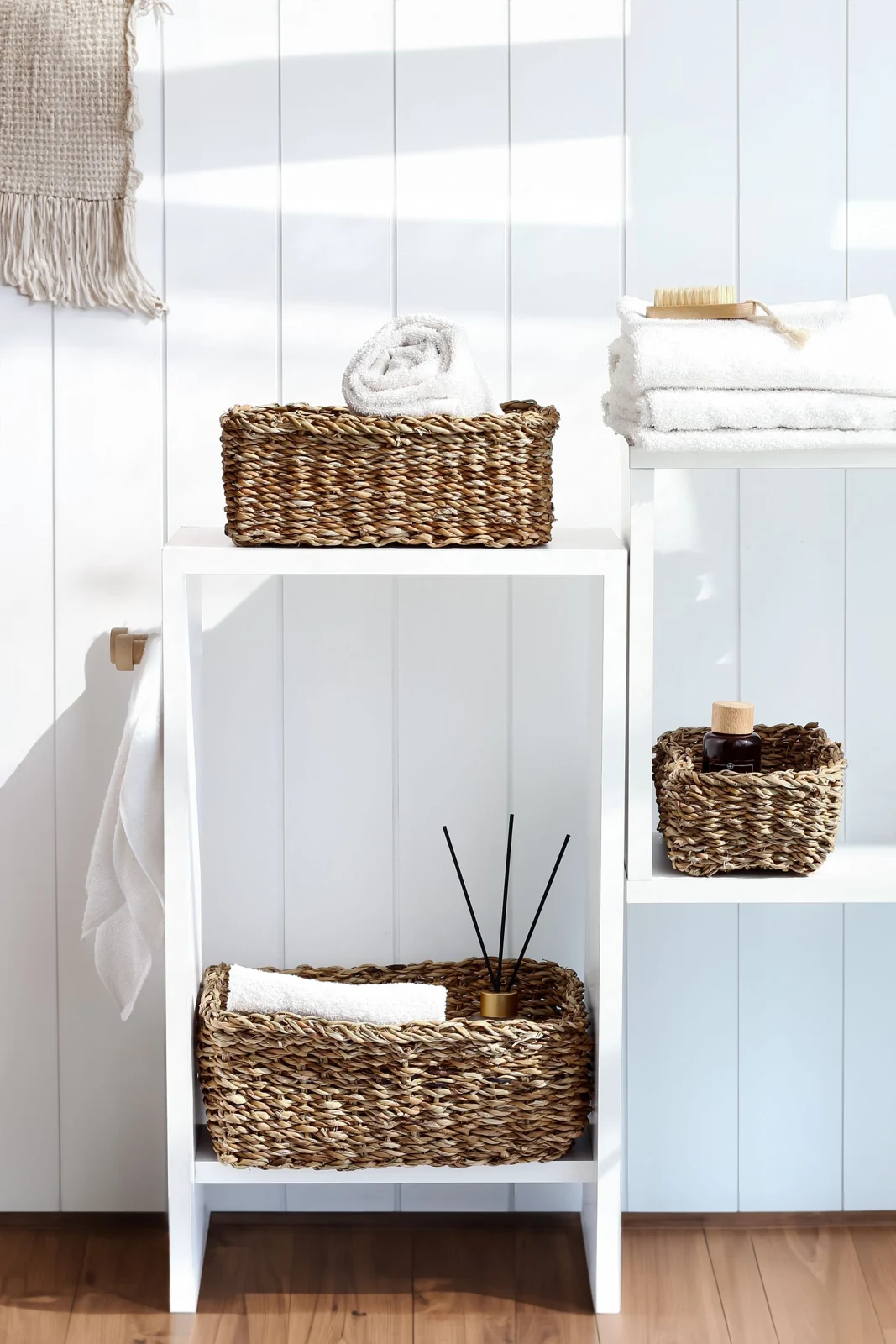 Baskets on bathroom storage shelves