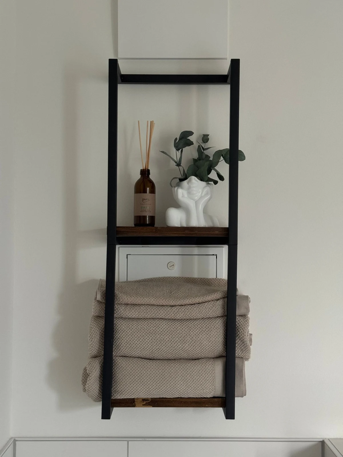 Towel storage on a wall rack