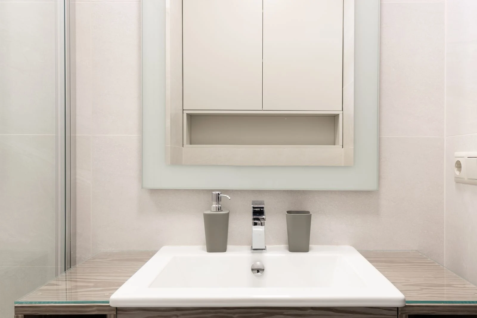 White bathroom vanity and mirror